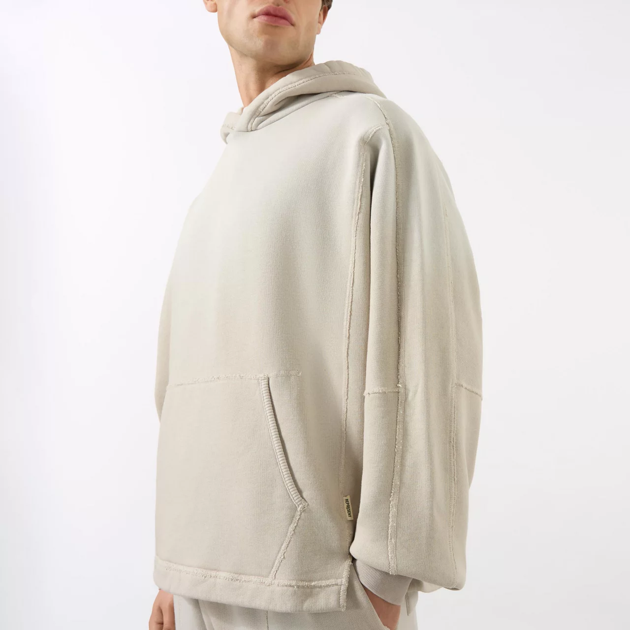 REPRESENT Step Hem Hoodie - Beige